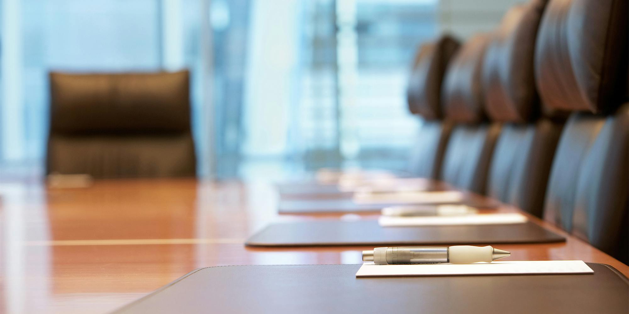 Empty business chairs around table