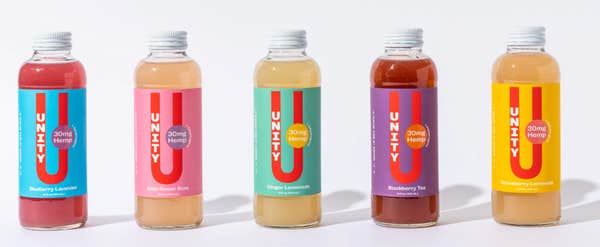 unity wellness co's line of hemp drinks on a gray background