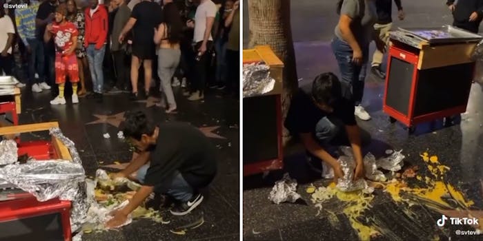 man cleaning spilled food from Hollywood walk of fame