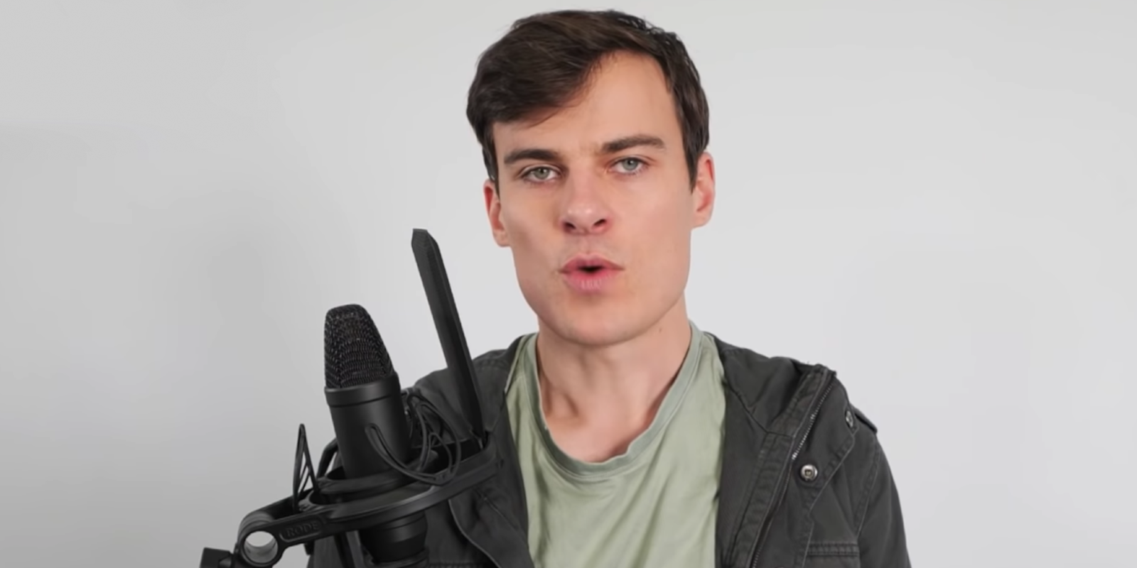 A man speaking into a microphone over youtube arrest