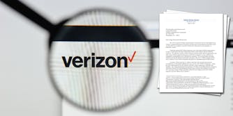 A magnifying glass over the Verizon logo. Next to it is a letter senators wrote to the FCC about Verizon's proposed acquisition of TracFone.