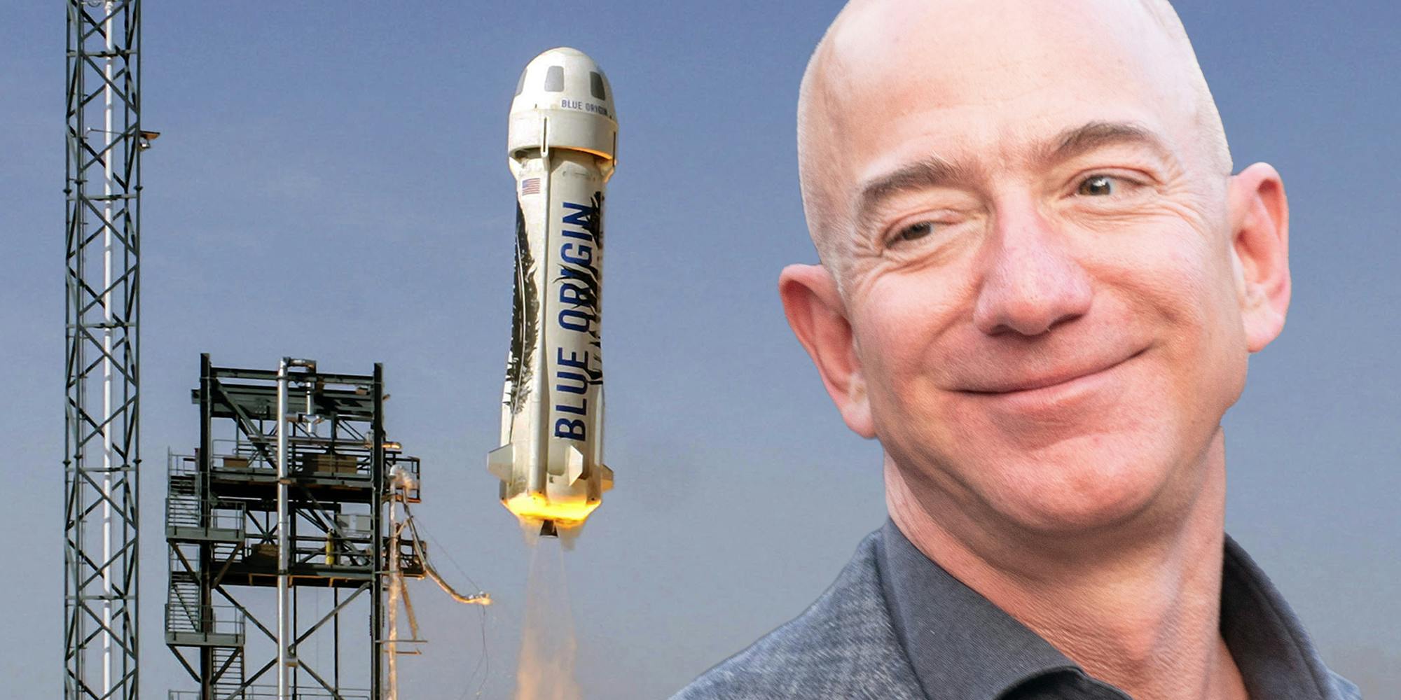 Jeff Bezos smiling and looking at Blue Origin spacecraft