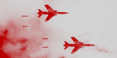 Two fighter planes flying.