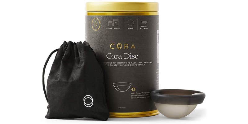 cora menstrual disc with packaging and silk case.