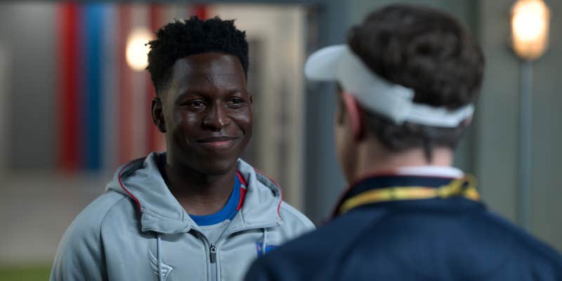 soccer player talking to coach