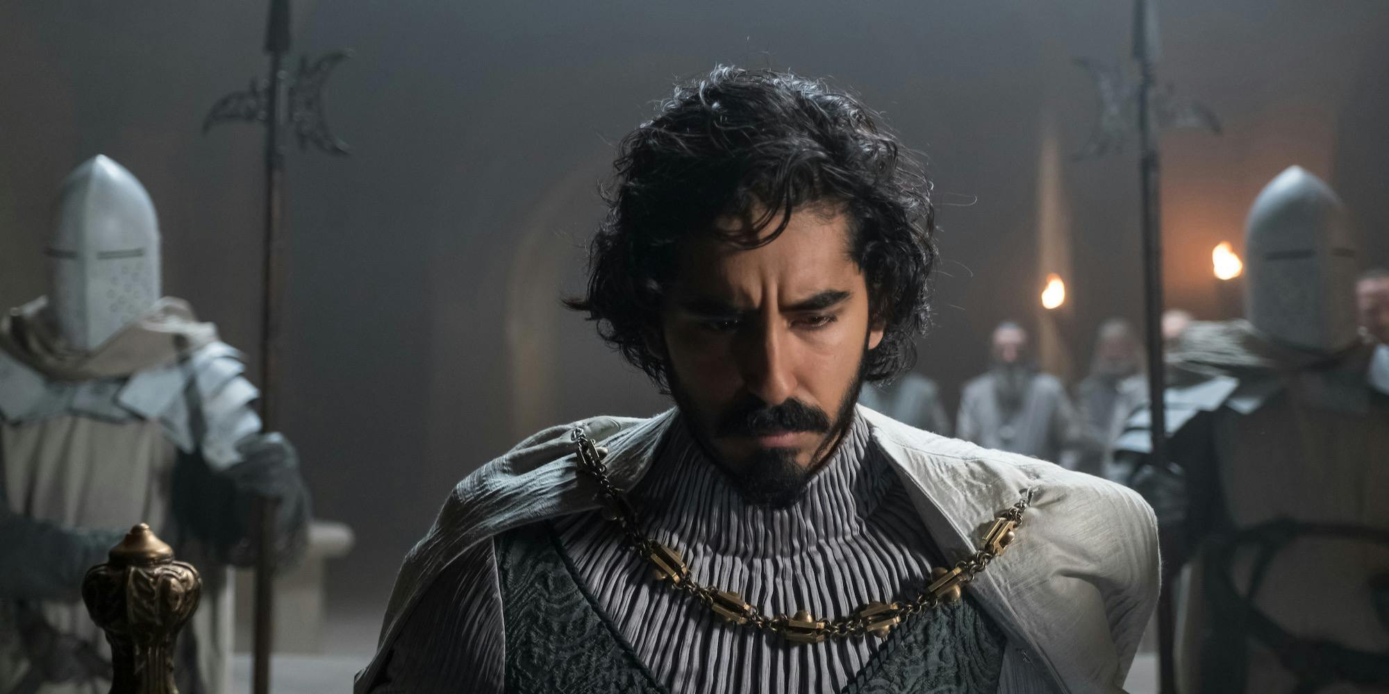 dev patel kneeling in the green knight