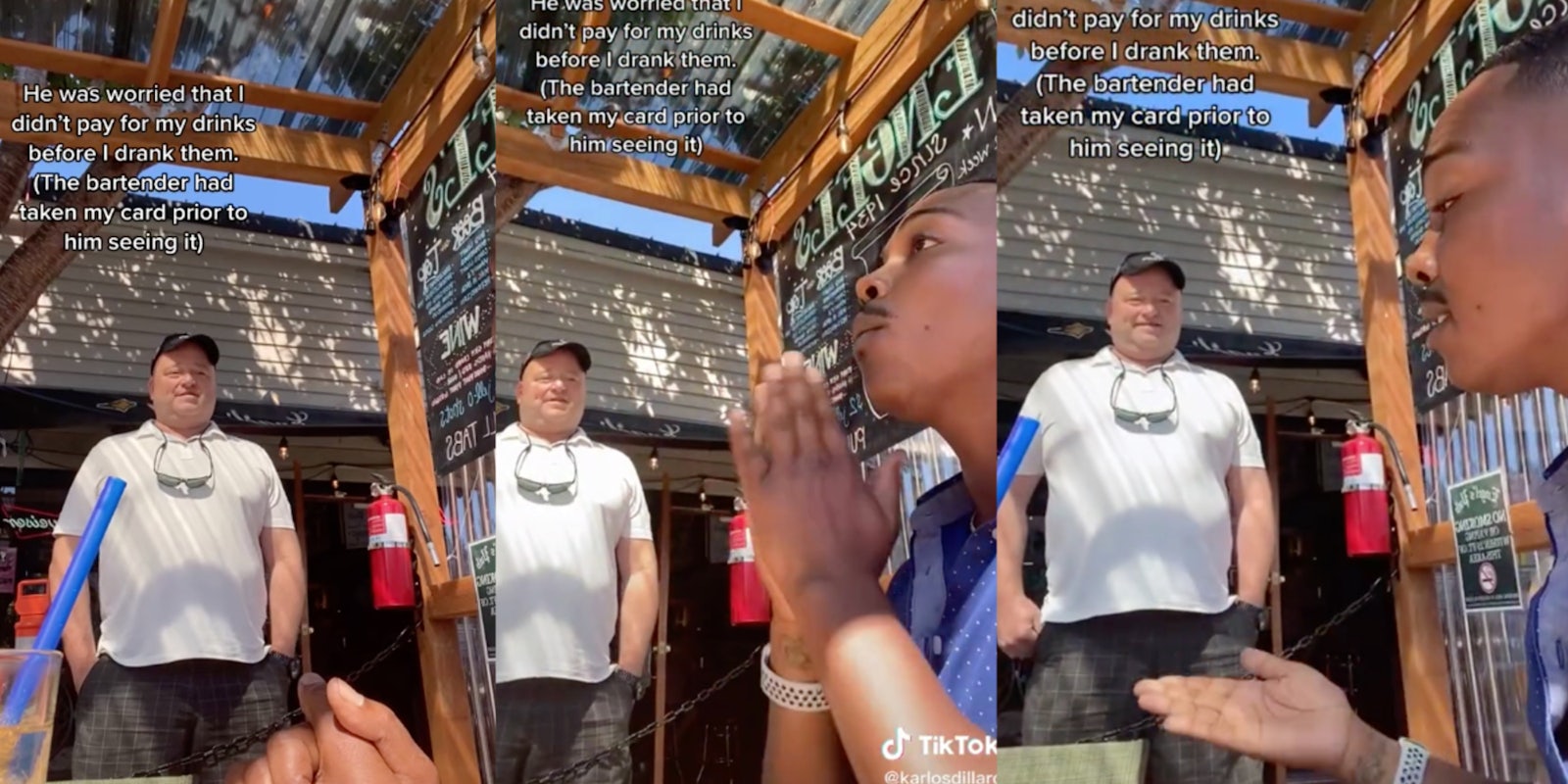 white man standing while black man speaks to him at bar