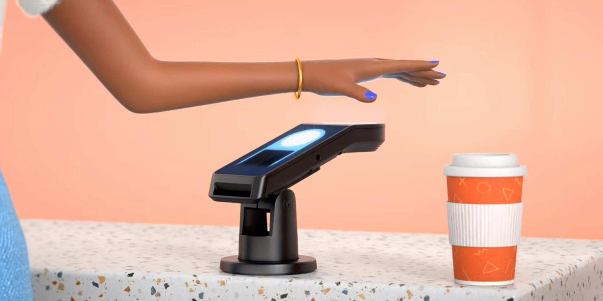 A screenshot from an Amazon video demonstrating how its Amazon One palm print scanner works.