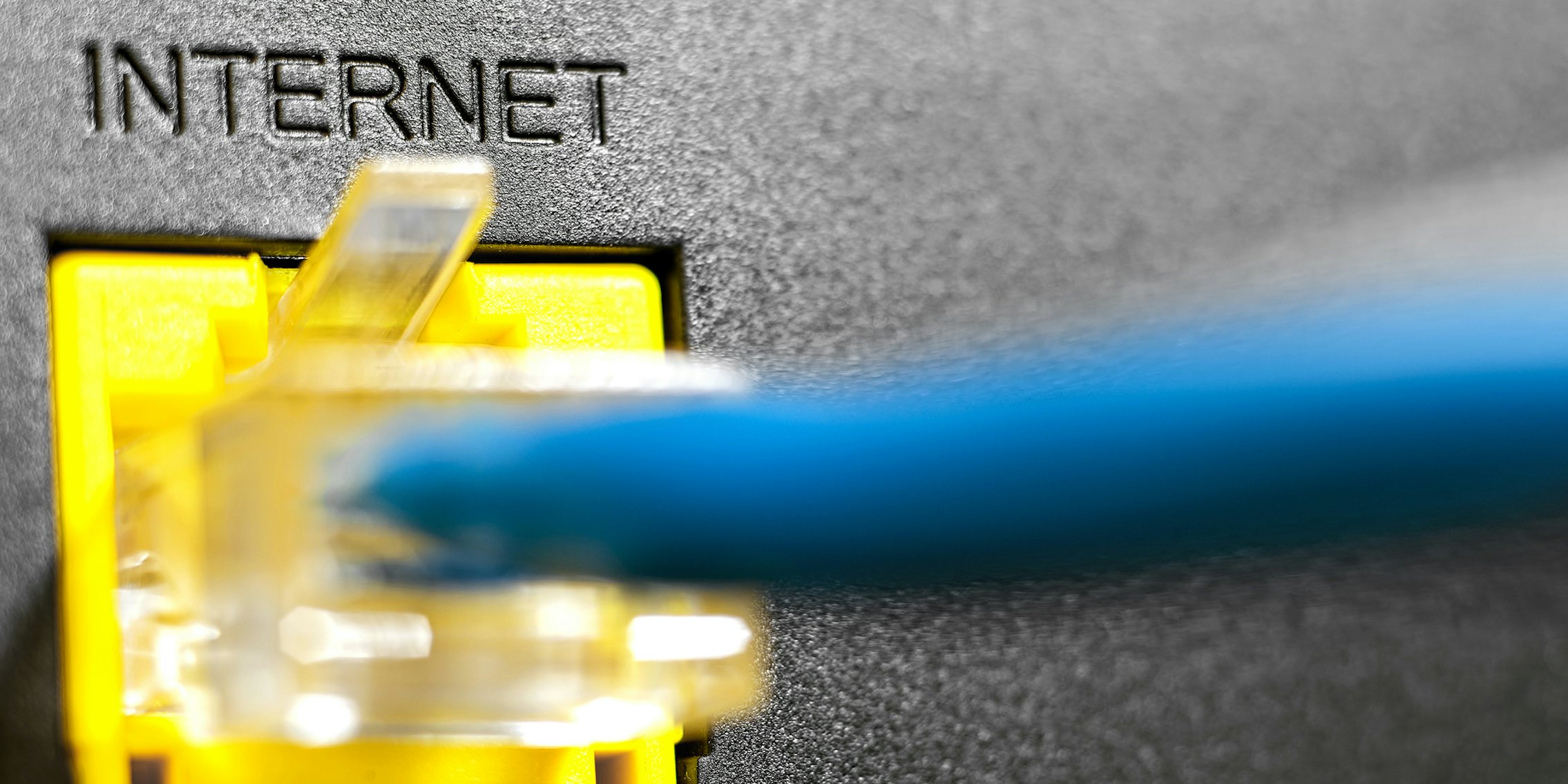 An ethernet cord delivering broadband internet to a router.