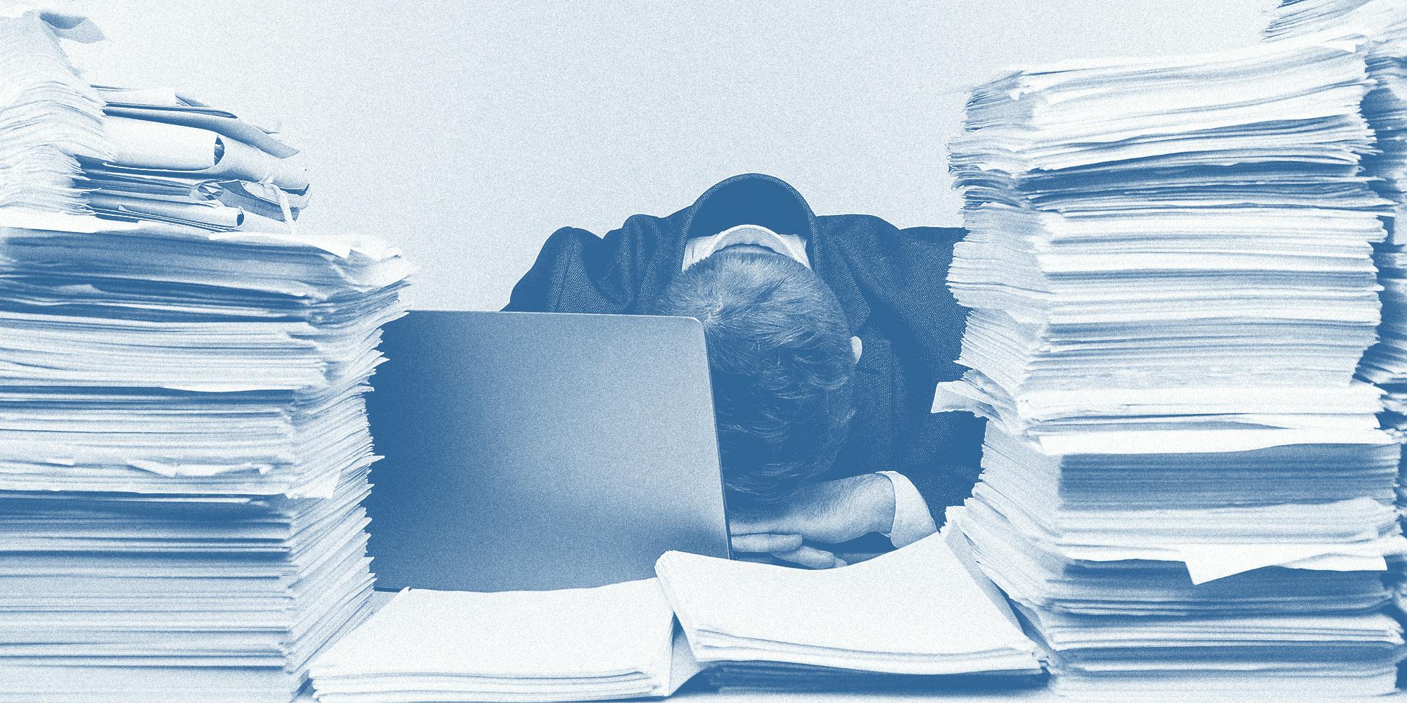 A man surrounded by files.