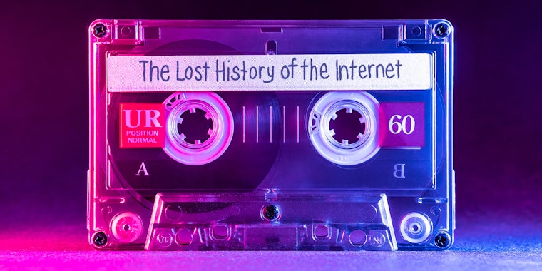 Transparent audio cassette tape lit by pink and blue lamps on a black background with 'The Lost History of the Internet' written on the label.