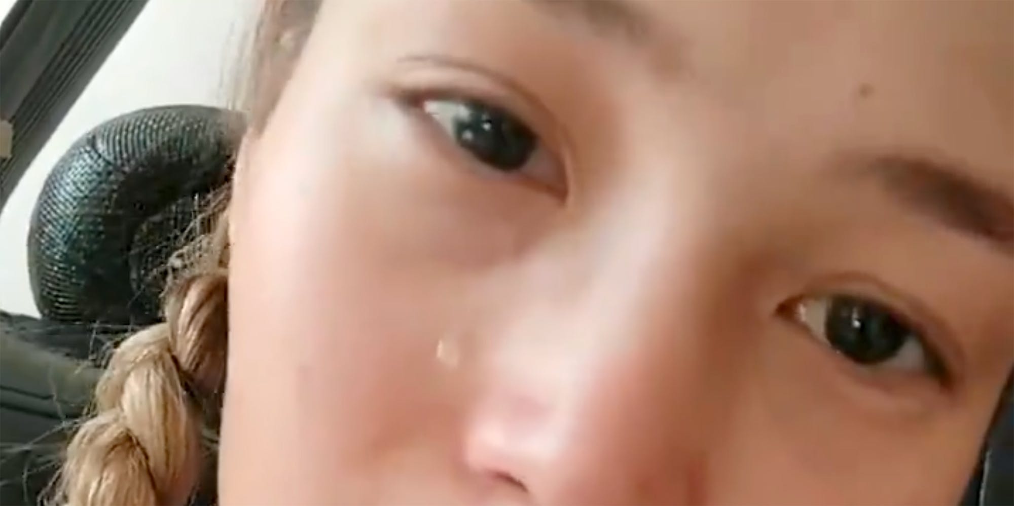 A young woman crying.