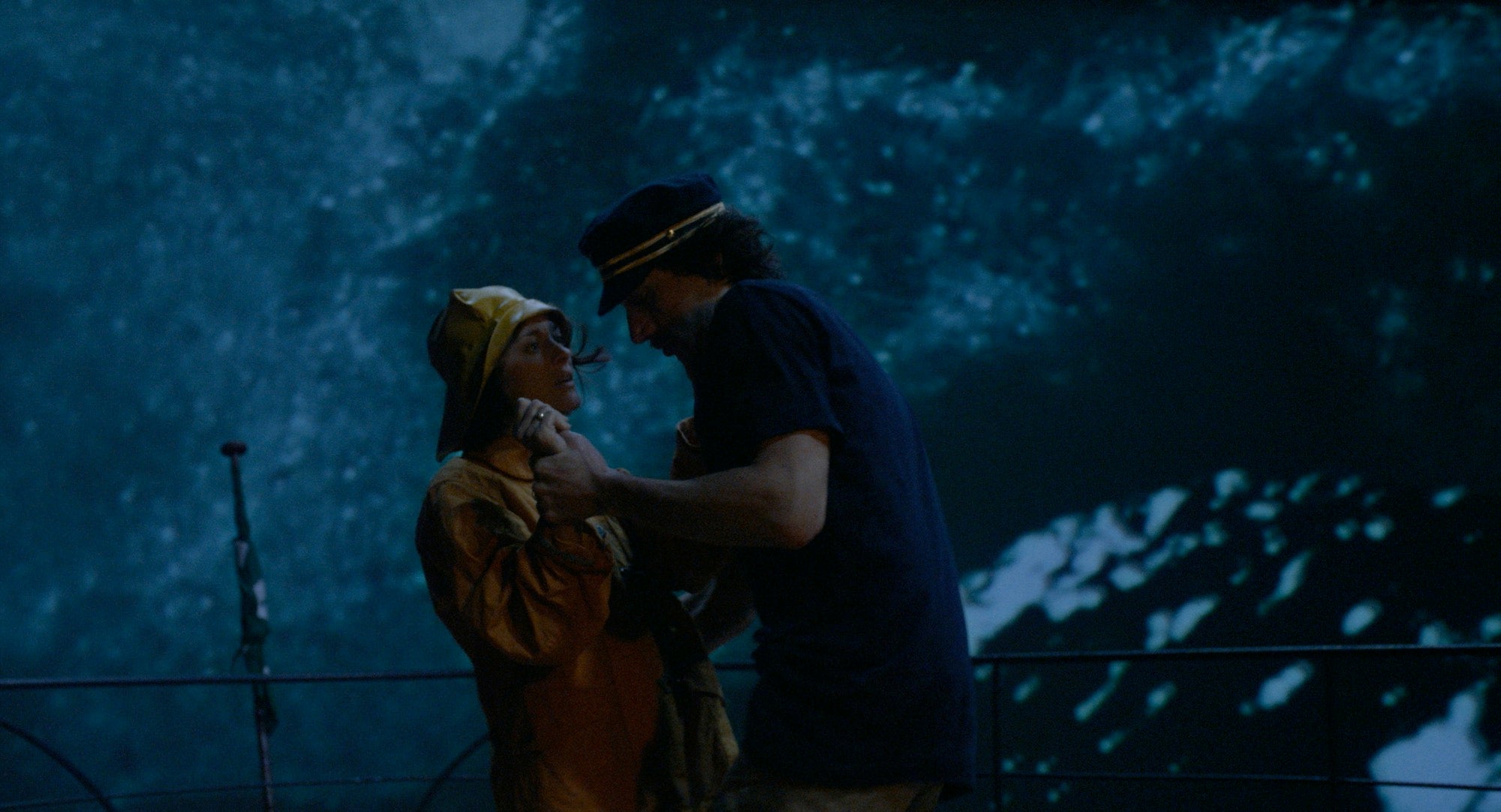 couple dancing on a boat in a storm