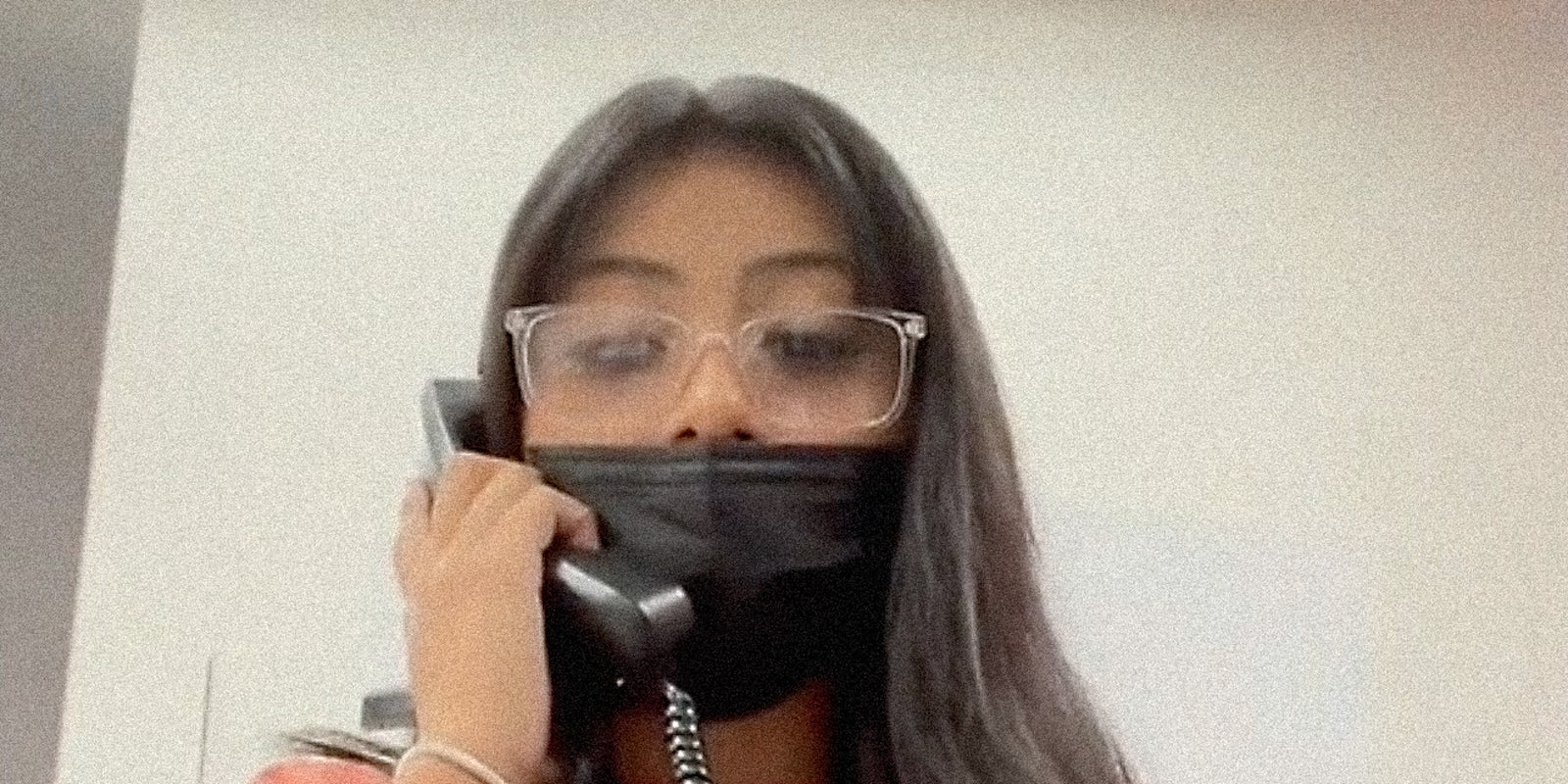 A woman on a telephone.