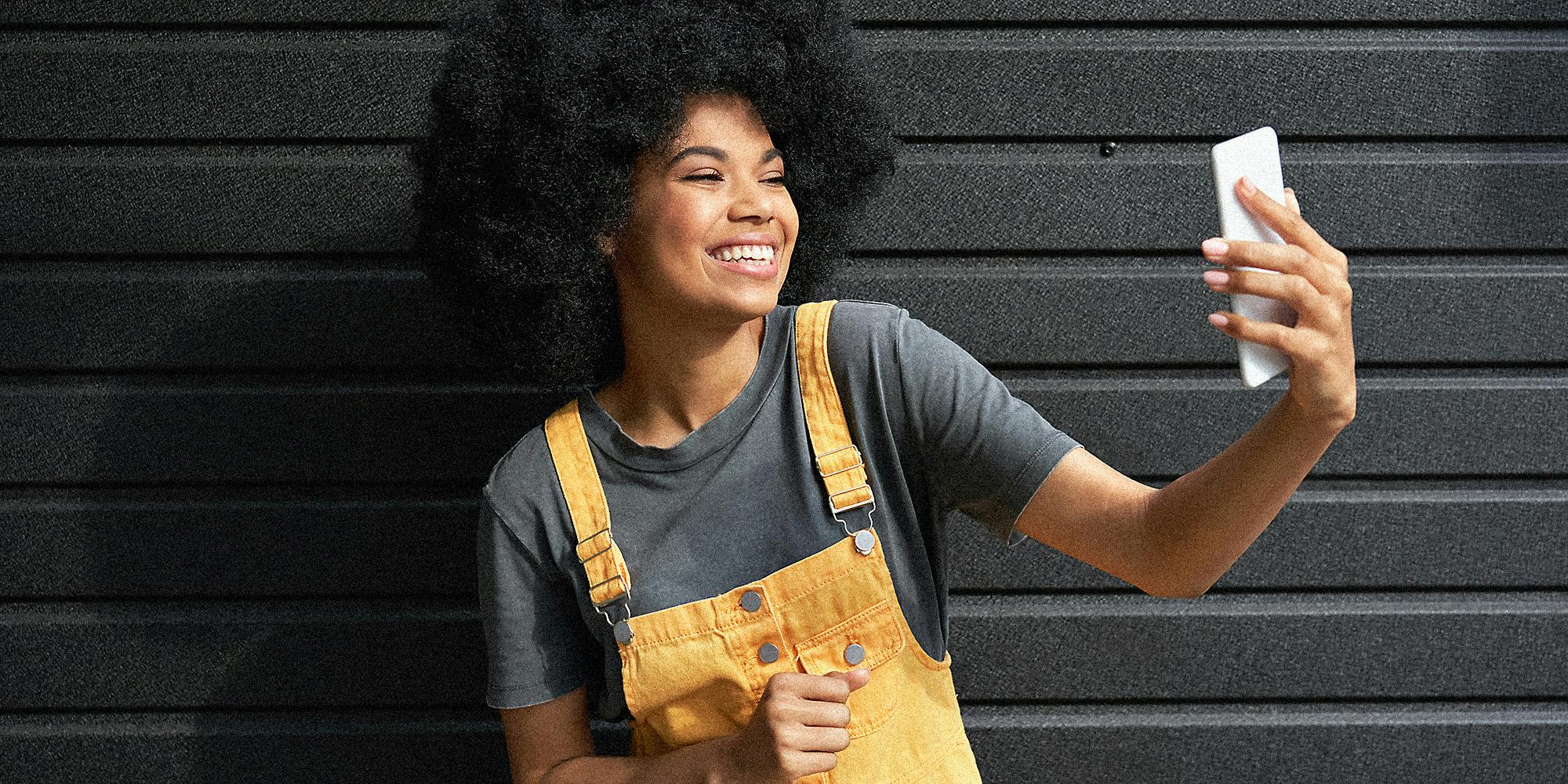 A woman interacting with her phone.