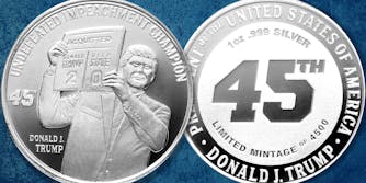 Silver coins struck with Trump holding up a sign reading "Acquitted - Donald Trump 2 / Deep state 0" with Undefeated Impeachment Champion Donald J Trump