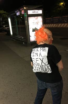 Kelsey Caine kick me sign