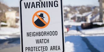 neighborhood watch sign in the snow