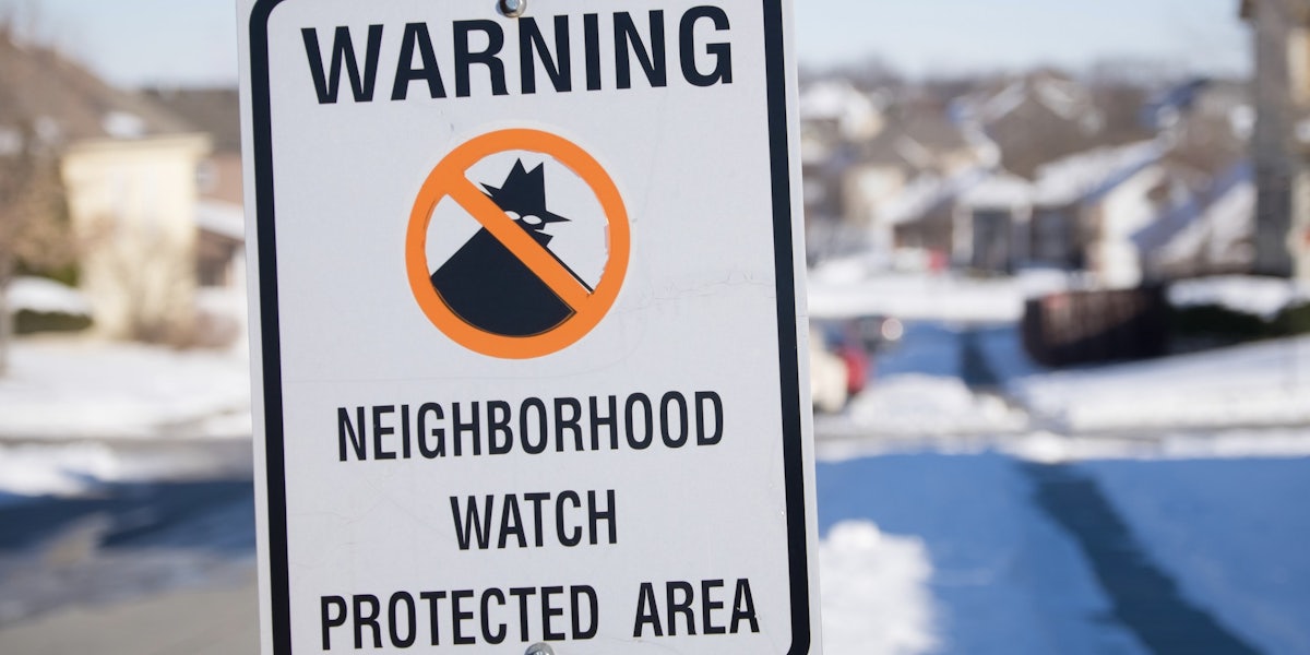 neighborhood watch sign in the snow