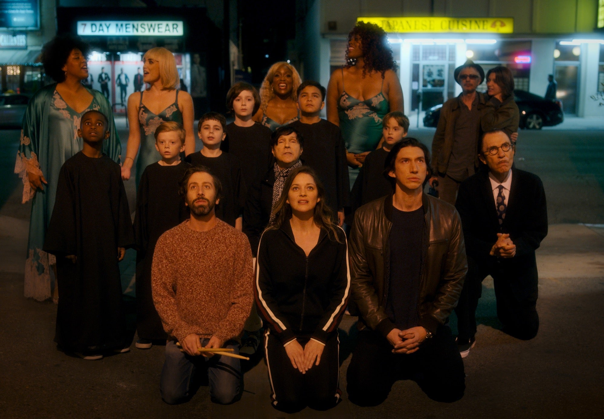 group of people standing and kneeling