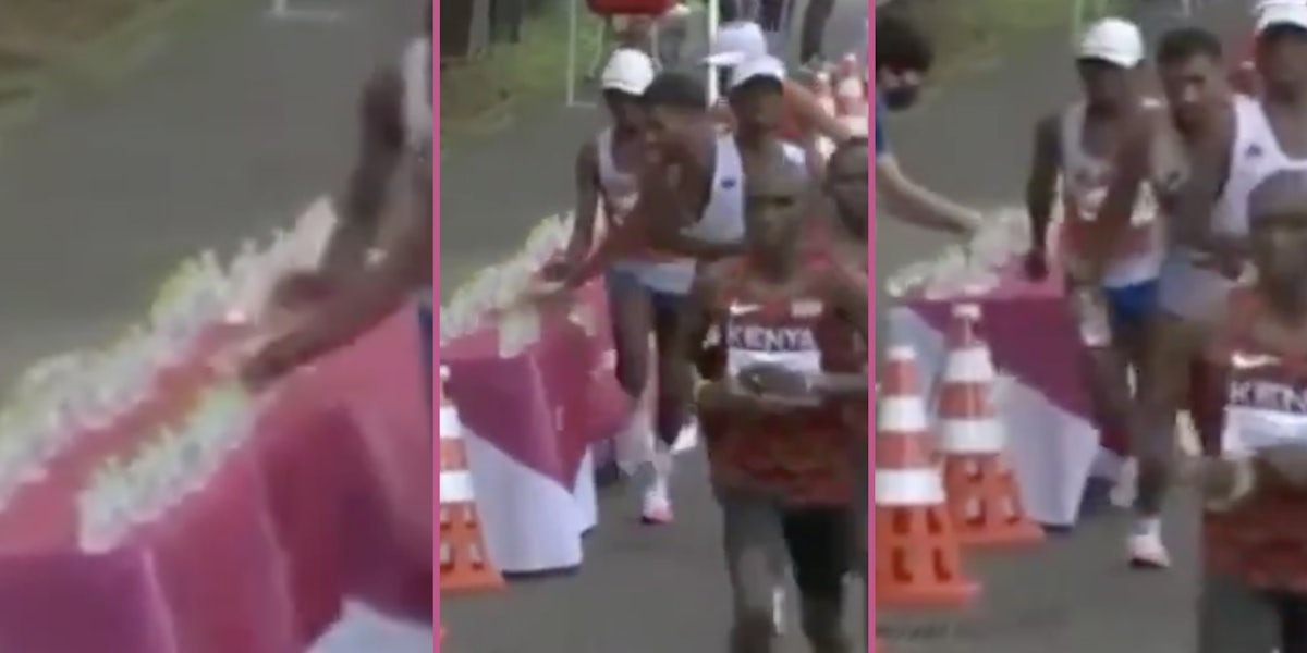 olympic marathoner knocks over water bottles
