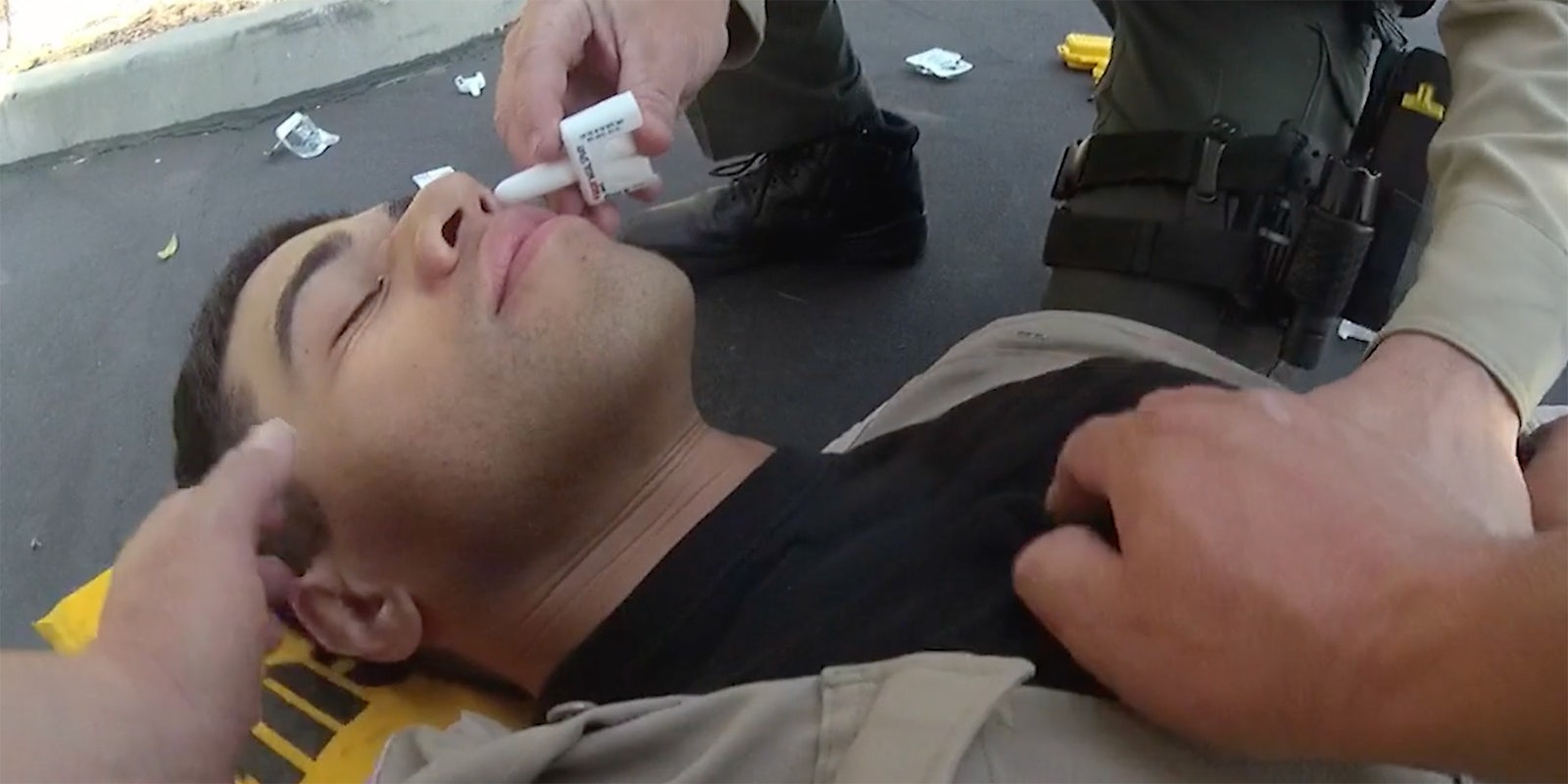 A police officer being given medication.