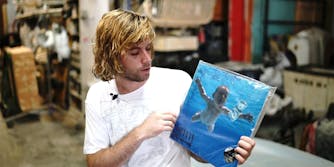 A man holding a vinyl record.