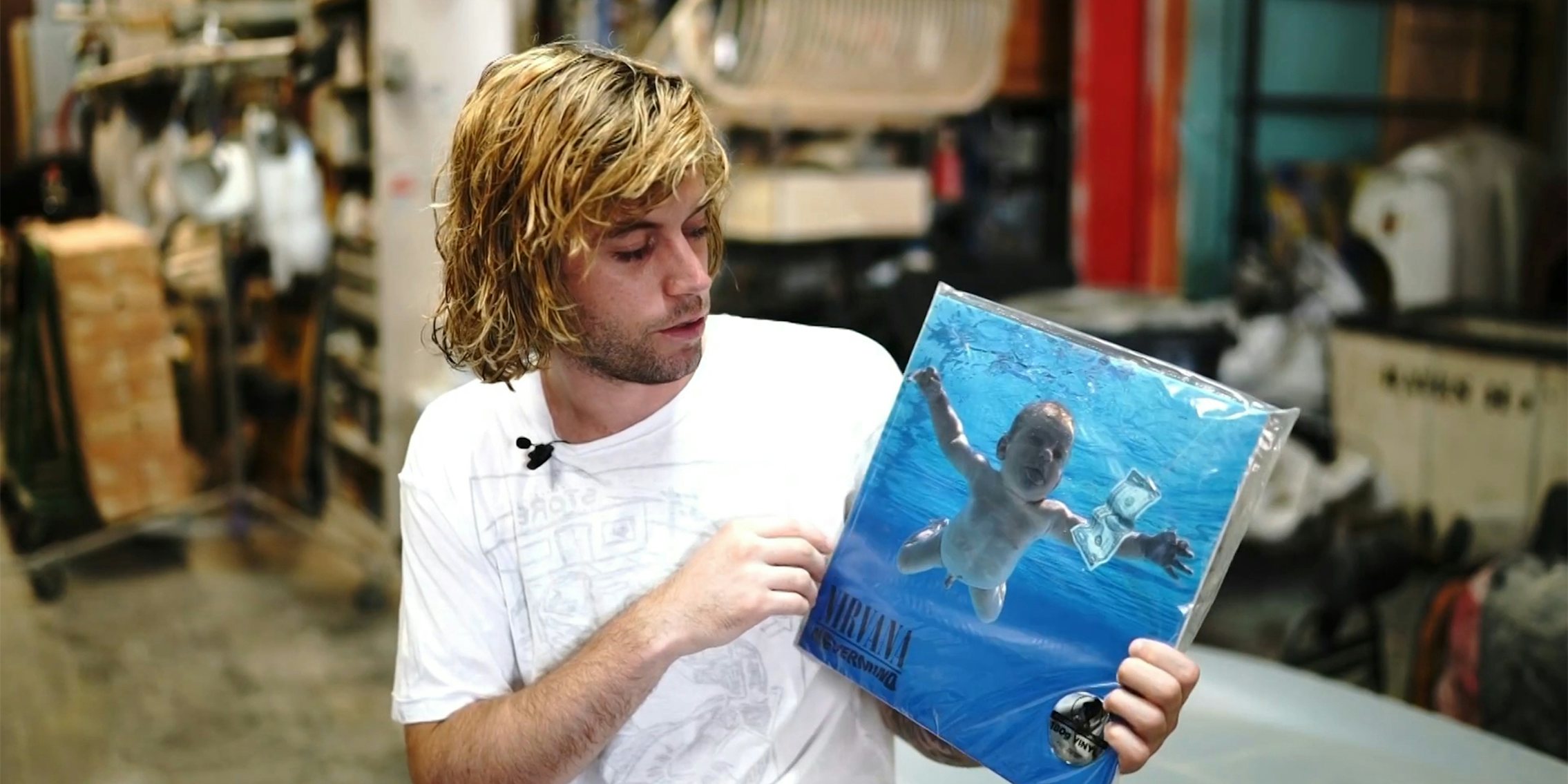 A man holding a vinyl record.