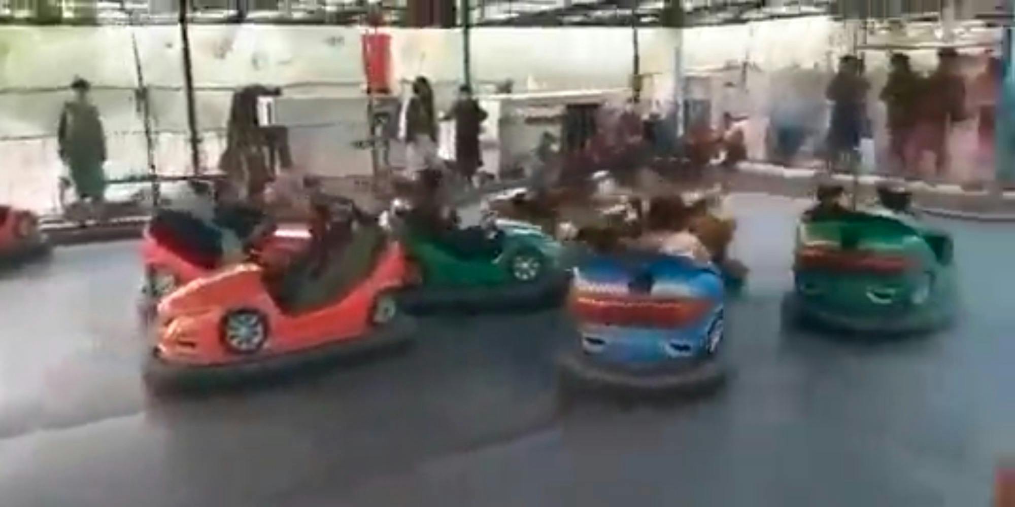 Members of the Taliban riding bumper cars