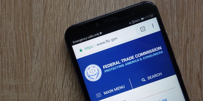 A smartphone showing the website of the Federal Trade Commission (FTC).