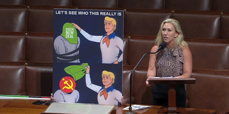 Rep. Marjorie Taylor Greene speaking on the House floor next to a Scooby Doo meme.