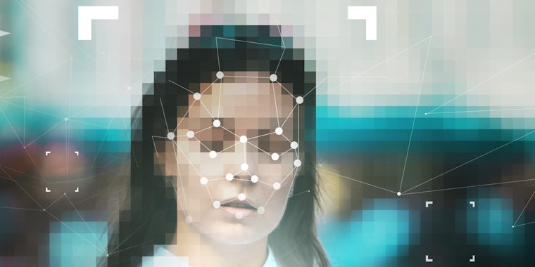 A woman's face being scanned with facial recognition technology.