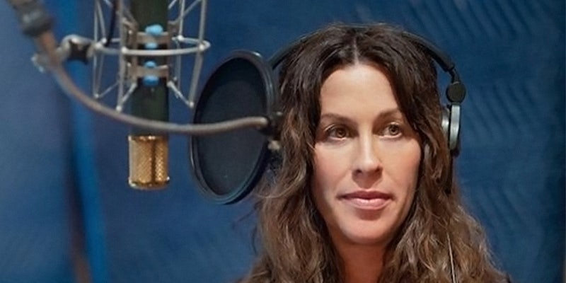 Alanis Morissette with headphones and a condenser mic