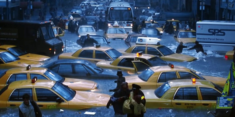 flooded NYC street filled with people, cabs, and buses