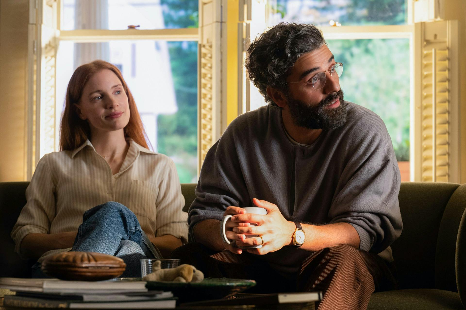 woman (left) and man (right) sitting on a couch