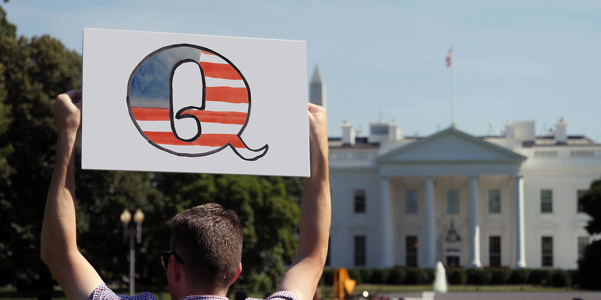 A man holding a sign.