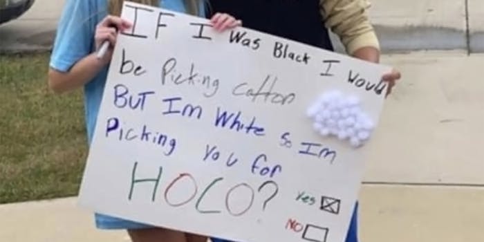students holding sign that reads "If I was Black I would be picking cotton but I'm white so I'm picking you for HOCO? Yes X No _"