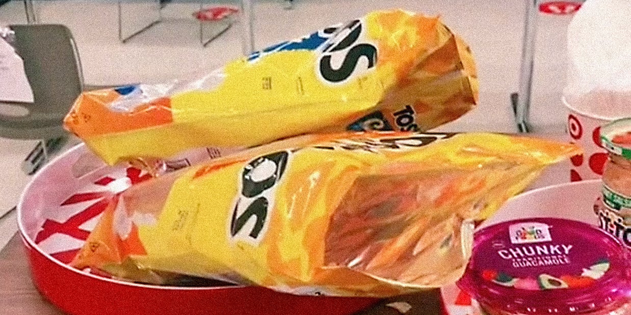 Chips and dips on a table.