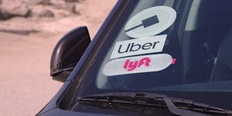 car with uber and lyft stickers on windshield