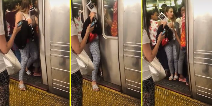 A woman pushing herself onto a subway car.