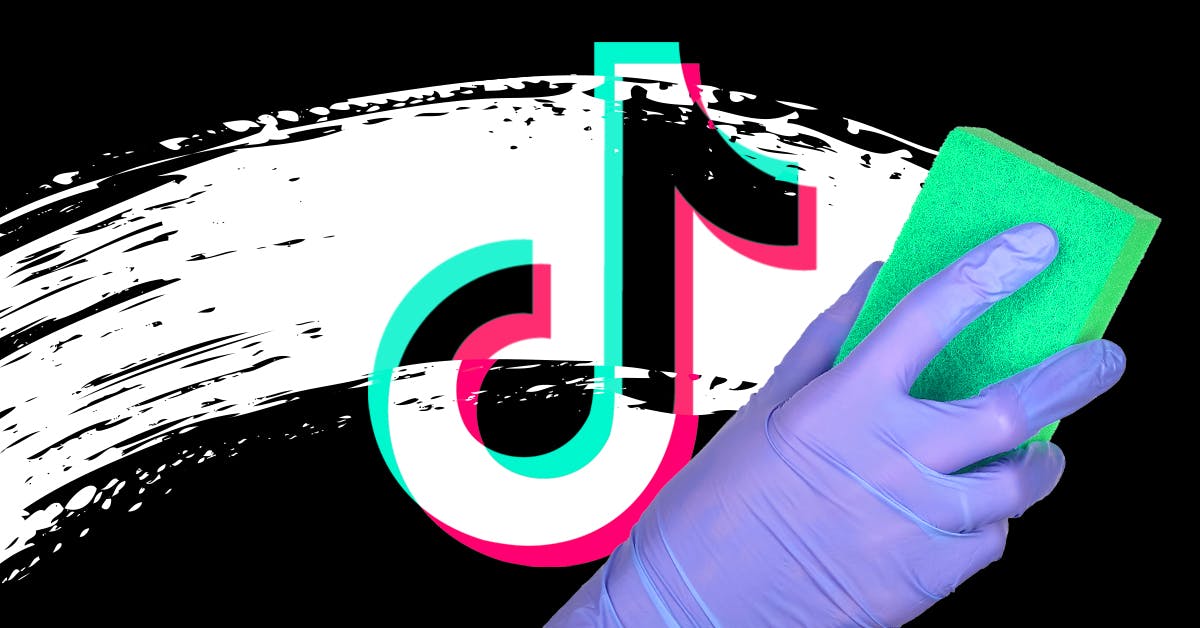 A person using a sponge to wipe grime off the TikTok logo.