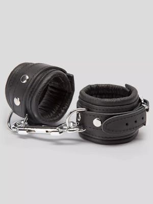 Two black leather cuffs with silver accents