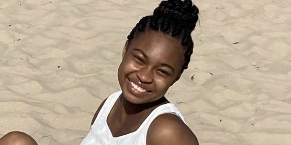Young woman smiling on the beach