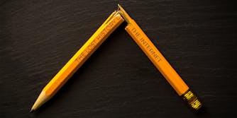 Broken pencil with phrase "The Lost History of the Internet" imprinted on the side