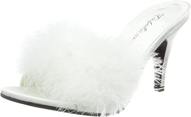 White kitten pleaser heels with white feathers at the front