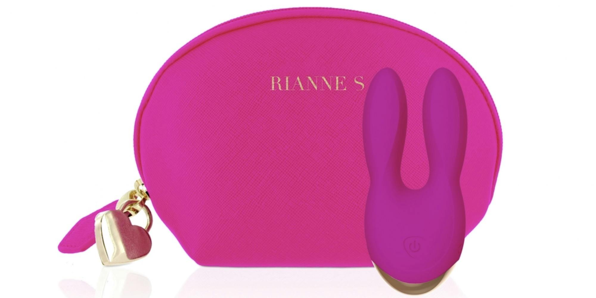 Rianne vibrator, a pink device with two bunny ear shaped prongs, in front of a carying case