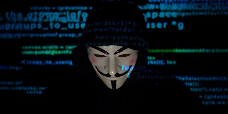 A person wearing the Guy Fawkes mask associated with Anonymous
