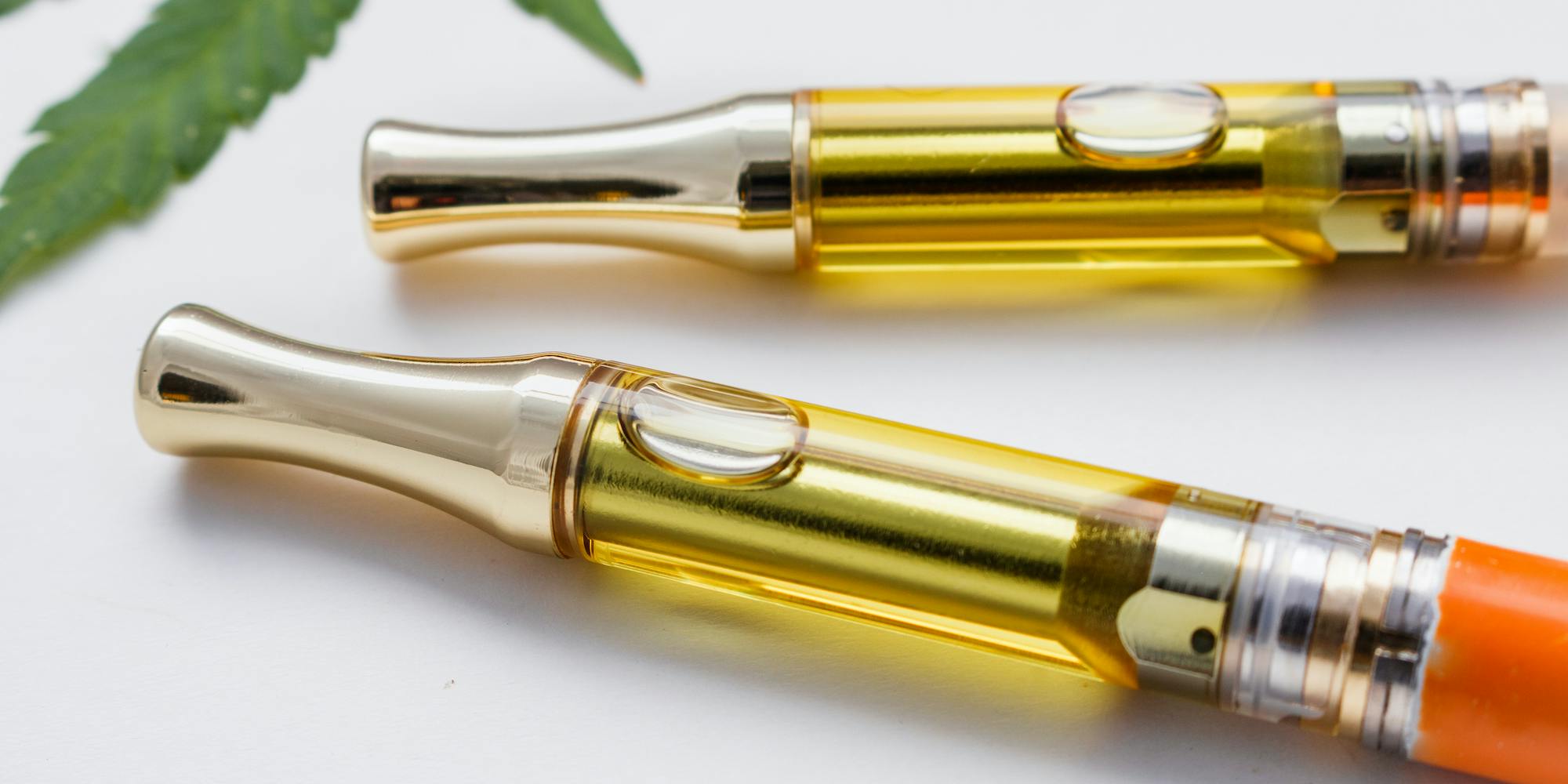 Two full gram cannabis oil vape pens. THC/CBD extract oil and terpenes inside glass cartridges. An alternative method of smoking marijuana, medical, recreational.