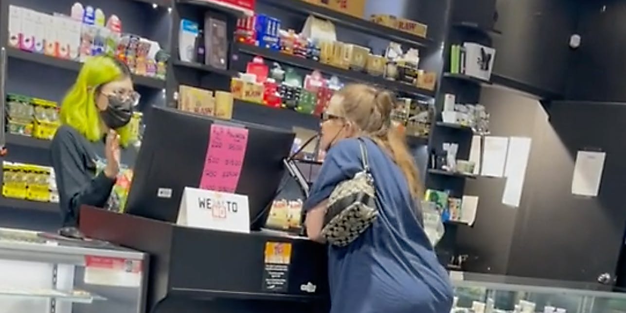 A woman yelling at a worker.