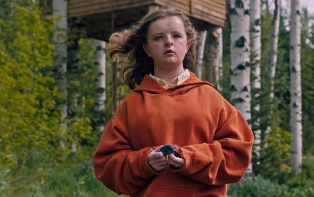Charlie from Hereditary, wearing a yellow shirt and orange hoodie